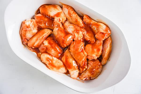 overhead view of Baked BBQ Chicken Wings in a white dish 
