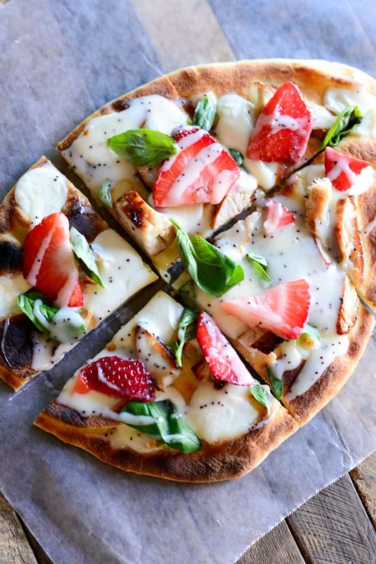 grilled chicken strawberry pizza on a brown table