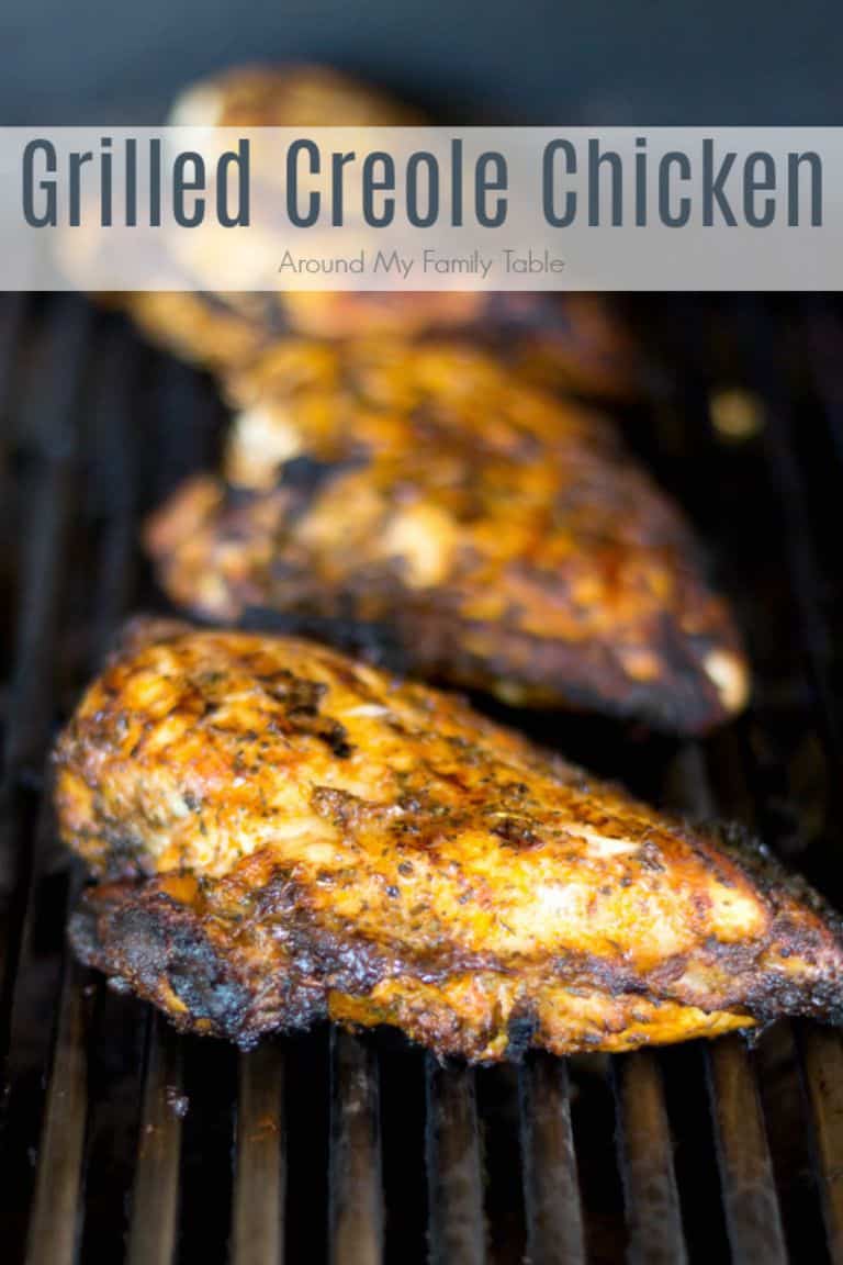grilled creole chicken on a grill grate
