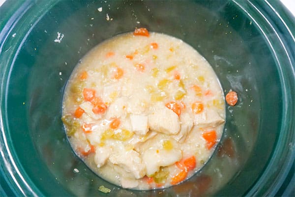 chicken soup and dumplings in a green crockpot