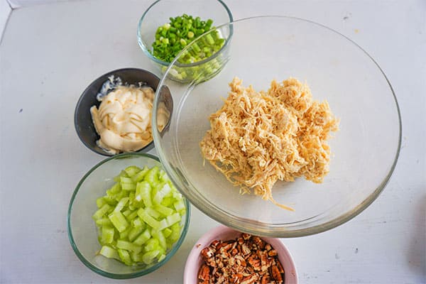 bowls of ingredients needed to make homestyle chicken salad