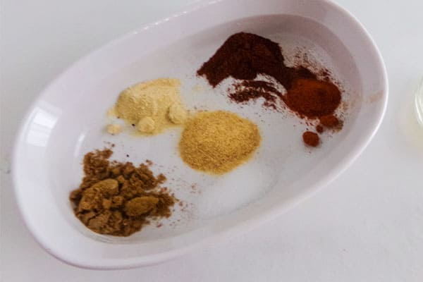 spices in a white baking dish
