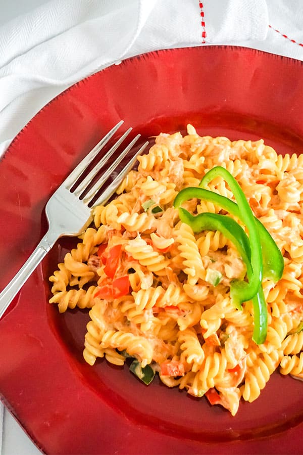 Mexican Chicken Pasta and a fork on a red plate 