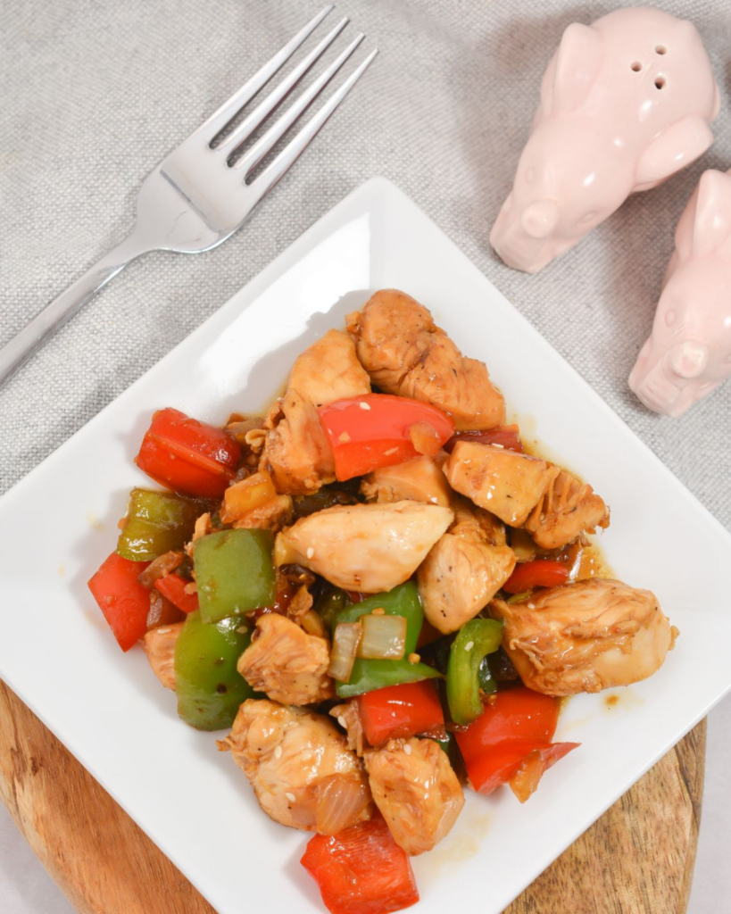 Keto Chicken Stir-Fry on a plate with a fork on the side.