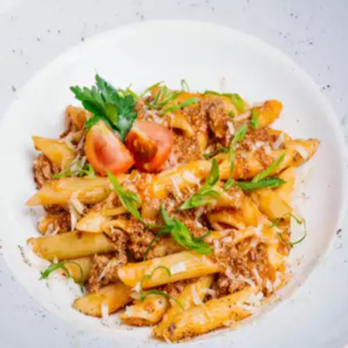 Penne pasta with ground chicken and tomatoes