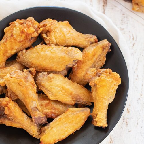 crispy chicken wings in a pan