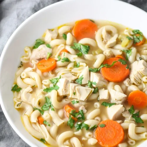 chicken noodle soup with veggies in a bowl