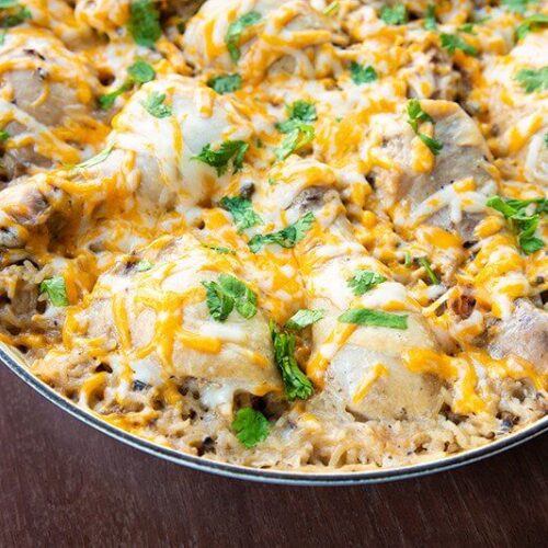 creamy chicken casserole topped with cheese and herbs