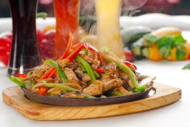 chicken and vegetables piled together on a dish